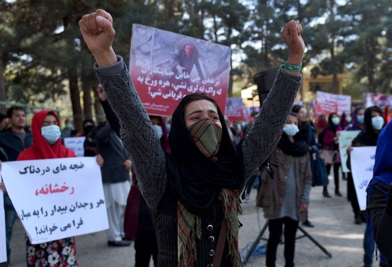 Afghan Solidarity members hold posters and chant slogans as they stage a protest against Taliban militants who stoned an Afghan woman to death, at Shar-e-Naw Park in Kabul on November 6, 2015.  Dozens of Afghan Solidarity members staged a protest in Kabul to condemn the stoning to death of an Afghan woman accused of adultery in the Taliban-controlled area just outside Firozkoh, the capital of central Ghor province. AFP PHOTO / Wakil Kohsar        (Photo credit should read WAKIL KOHSAR/AFP/Getty Images)